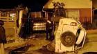 Auto impactó con la reja de una casa en Puerto Montt y luego volcó